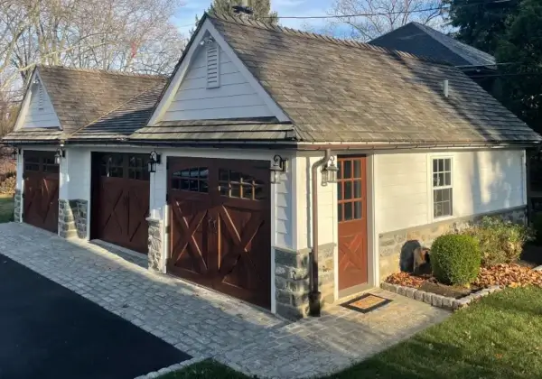 Stylish two-car garage with wooden doors.