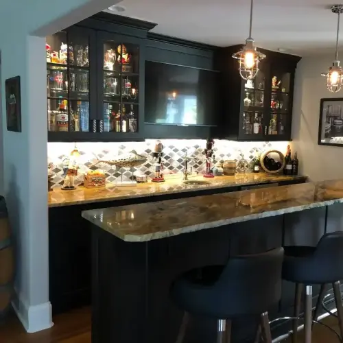 Home bar with stools and glass cabinet.