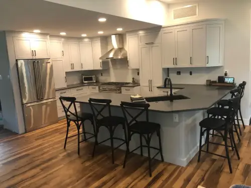 Modern kitchen with island and seating.