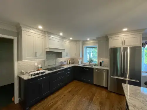 Modern kitchen with stainless steel appliances and cabinets.