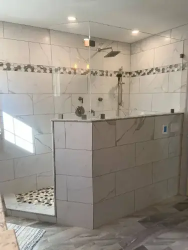 Modern marble tile shower with glass door