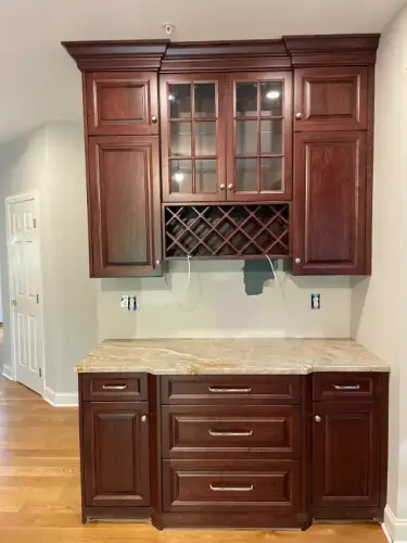 Wooden cabinets with built-in wine rack and counter