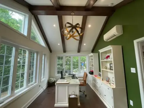 Modern home office with large windows and desk