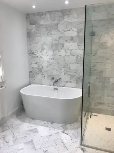 Modern marble bathroom with bathtub and shower