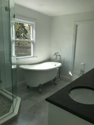 Modern bathroom with freestanding tub and glass shower