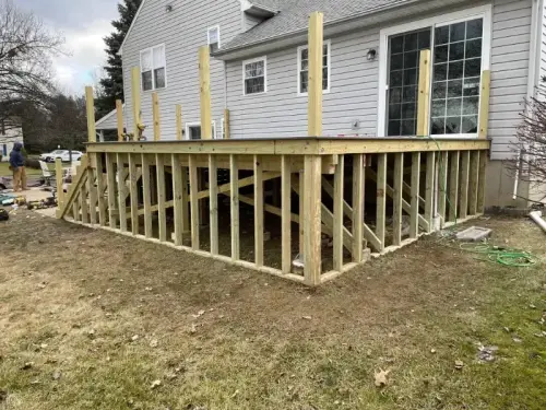 Wooden deck under construction at house exterior
