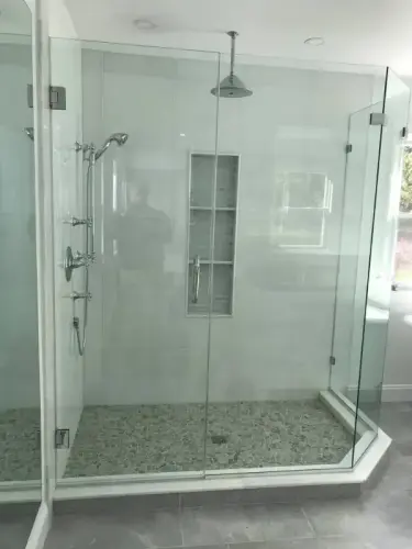 Modern glass shower with stone floor